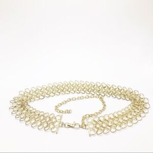 Gold chain-linked waist belt. 